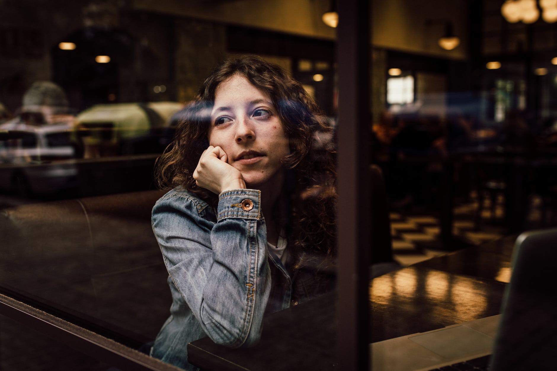 A woman waiting in a restaurant.