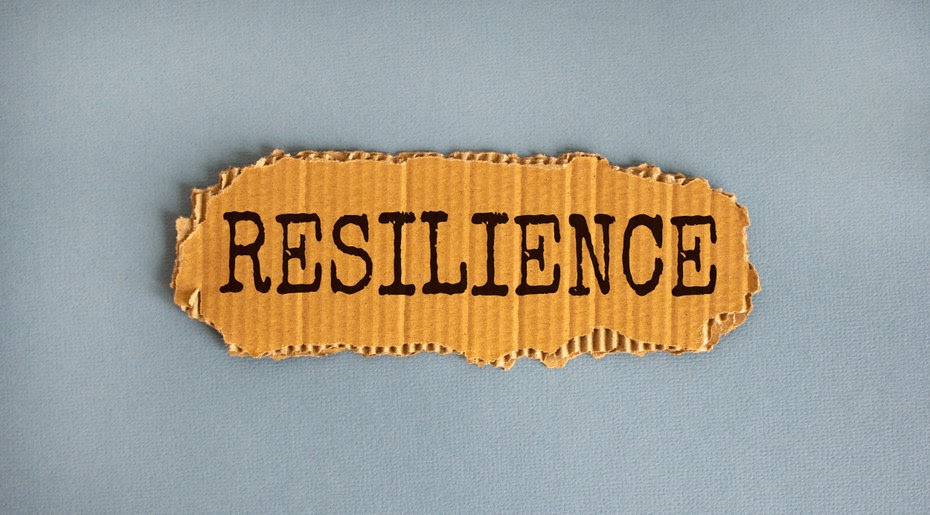 The word "resilience" on cardboard.
